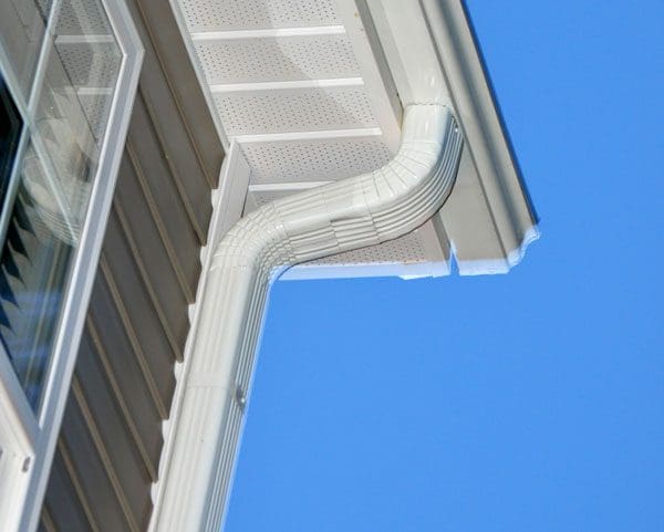 Gutter and downspout on the side of a house