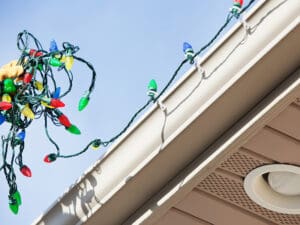 Hanging Christmas lights on a house